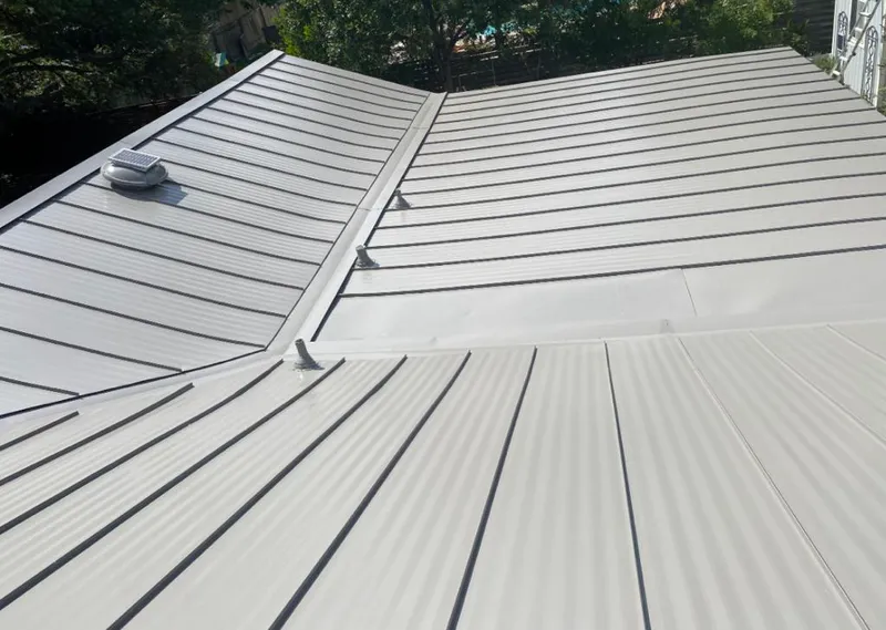 Solar attic fan installed on a metal roof for Roof Ventilation in Homestead